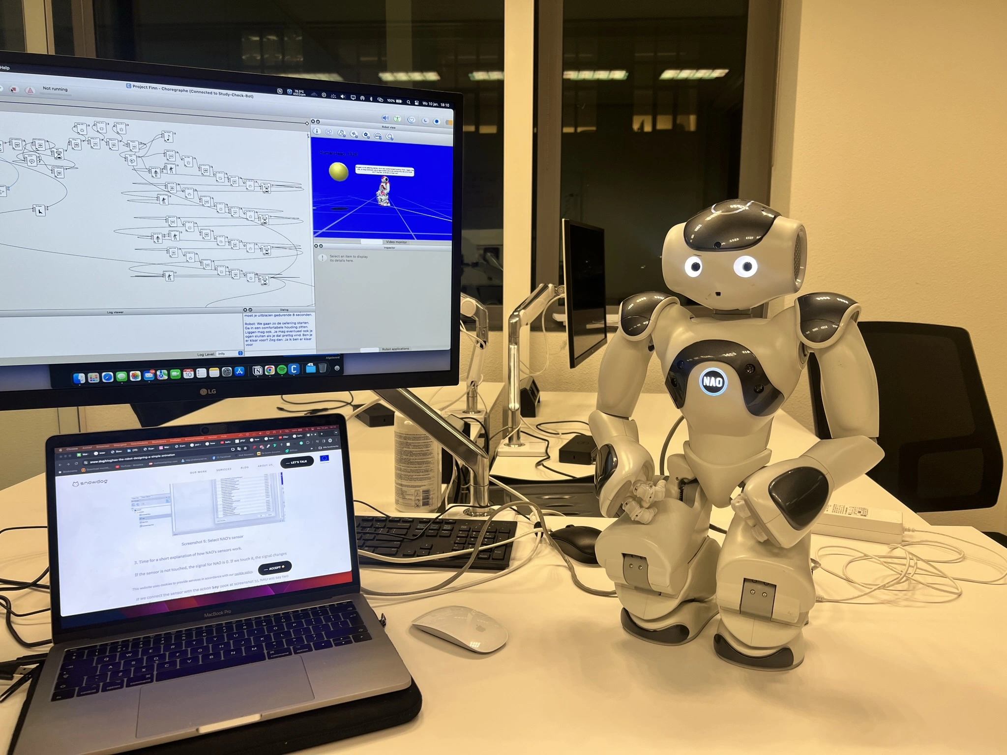 Robot Finn with its eyes lit blue during a breathing exercise test