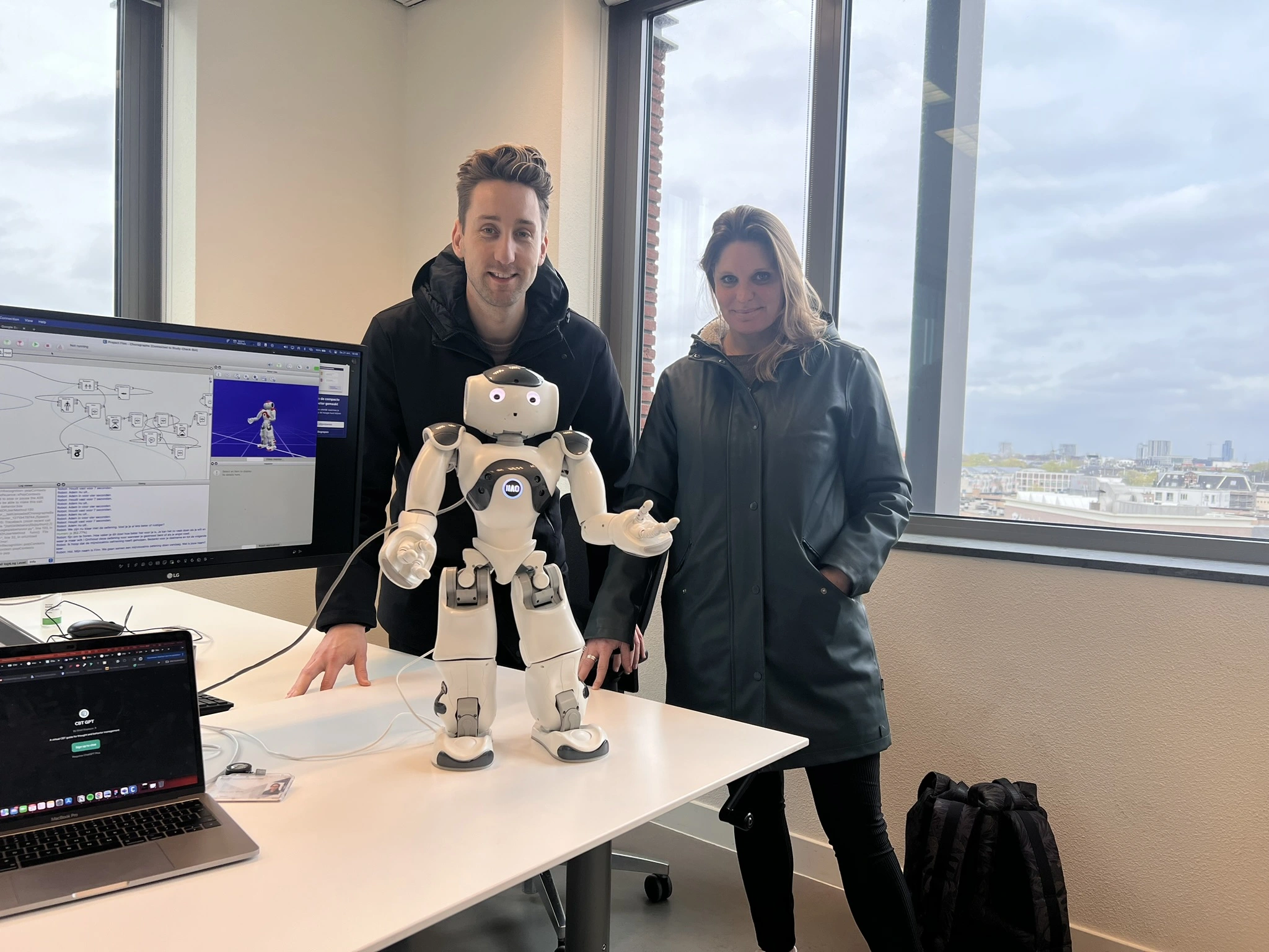 Robot Finn, a NAO robot, during a testing session with two participants